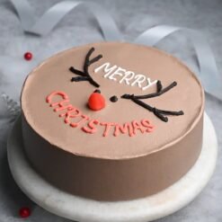 Chocolate Christmas Cake with creamy frosting – Perfect for Christmas dessert tables.