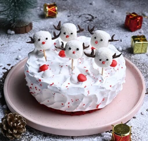 Red Velvet Cake with Mini Christmas Figurines – The perfect holiday cake decorated with miniatures for the season.