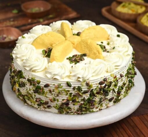 Indulge in the rich and creamy flavors of our Rasmalai Pista Whipped Cream Cake. A perfect fusion of pistachio and rasmalai, ideal for special occasions!