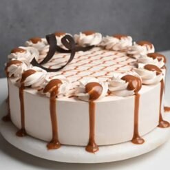 Sweet Caramel Whipped Drip Cake with creamy whipped frosting and caramel drizzle