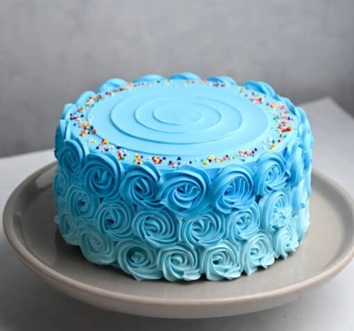 Round blue cream layer cake with smooth frosting for birthdays and celebrations.