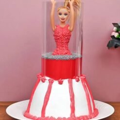 Cute Red Barbie Pull Me Up Vanilla Cake for a fun birthday celebration