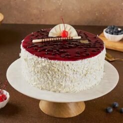 White Chocolate and Blueberry Cake with rich white chocolate layers and juicy blueberries