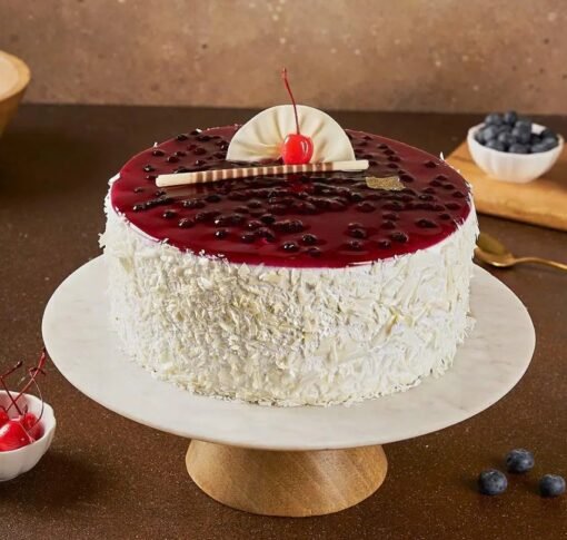 White Chocolate and Blueberry Cake with rich white chocolate layers and juicy blueberries