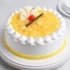 Pineapple Whipped Cream Cake with smooth whipped cream frosting and fresh pineapple pieces