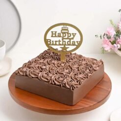 Close-up of a luxurious Rosette Chocolate Cake with smooth chocolate frosting and rosette design