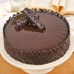 Decadent Chocolate Truffle Cake topped with smooth truffle cream and rich chocolate layers