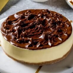 Nutella Royale Cheesecake - Velvety cheesecake topped with rich Nutella and hazelnut flavors