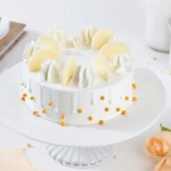 Close-up of Cloudy White Cream Cake showcasing airy texture and creamy frosting