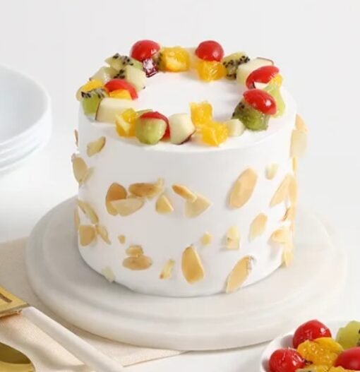 Fresh Fruit Cream Cake topped with vibrant, seasonal fruits and creamy frosting, perfect for special occasions