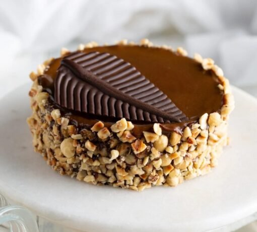 Hazelnut Praline Mousse Cake – A luxurious dessert with creamy mousse, praline crunch, and hazelnut flavors.