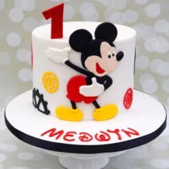 Mickey Mouse fondant birthday cake with cheerful design for celebrations