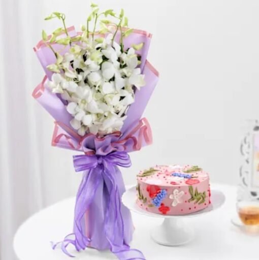 A stunning arrangement of white orchids with a delicious blushing treat, perfect for special occasions and heartfelt celebrations.