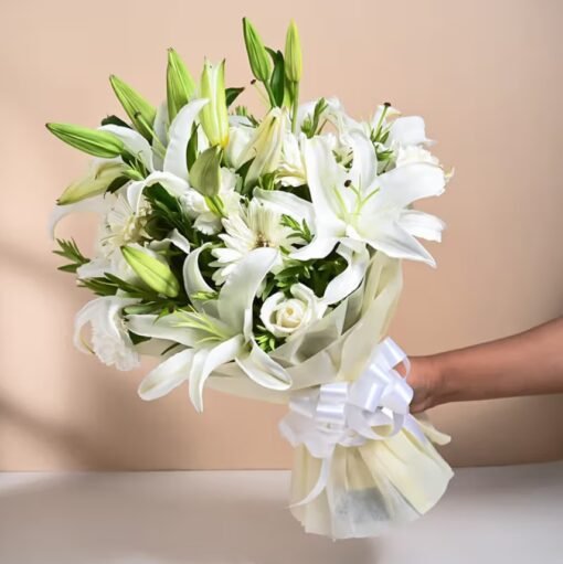 A stunning bouquet of luminous lilies, glowing with elegance and charm – the perfect floral gift to brighten any moment.