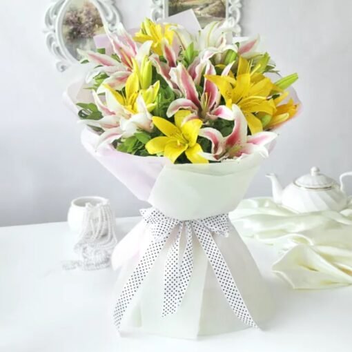 Elegant Pure Elegance Lily Arrangement featuring fresh, radiant lilies, exuding beauty and charm for heartfelt gifting and celebrations.