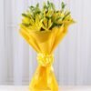 Sunshine Lily Bouquet featuring vibrant yellow lilies, exuding warmth, happiness, and elegance.