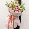 Beautiful Radiant Lily Harmony bouquet featuring fresh, vibrant lilies, exuding grace and harmony for special celebrations and heartfelt gifting.
