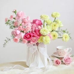 Stunning mixed flower bouquet featuring radiant lilies, roses, and seasonal blooms, embodying elegance, charm, and heartfelt emotions.