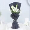 Serene Lily Arrangement featuring fresh white lilies, symbolizing peace, purity, and elegance.