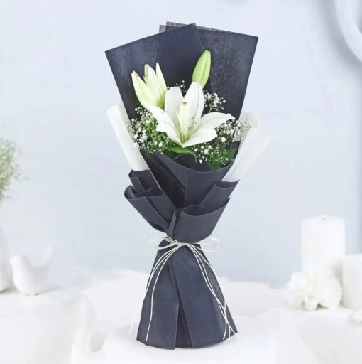 Serene Lily Arrangement featuring fresh white lilies, symbolizing peace, purity, and elegance.