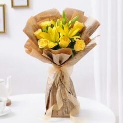 A charming bouquet of lilies and roses, radiating serenity and beauty – ideal for any special occasion or heartfelt gesture.