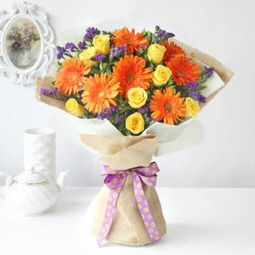 Vibrant Harmony Floral Arrangement featuring a lively mix of fresh, radiant flowers, elegantly arranged to add charm and joy to any occasion.