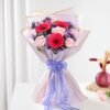 Elegant Rosy Glow & Gerbera Magic bouquet featuring vibrant roses and gerberas, creating a dazzling floral display for special moments.