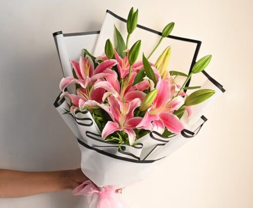 A charming bouquet of Whispering Bloom Lilies, radiating elegance and purity – a perfect floral gift for heartfelt celebrations.