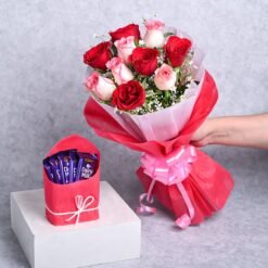 Elegant gift set featuring premium chocolates and fresh roses, ideal for romantic surprises, anniversaries, and heartfelt celebrations.