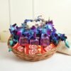 Elegant basket with vibrant orchids and indulgent chocolates, a romantic gift choice for special occasions like anniversaries and Valentine’s Day.