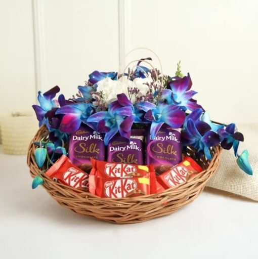 Elegant basket with vibrant orchids and indulgent chocolates, a romantic gift choice for special occasions like anniversaries and Valentine’s Day.