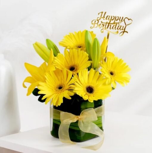 Stunning floral arrangement featuring delicate lilies and vibrant gerberas, perfect for brightening any occasion with grace and elegance.