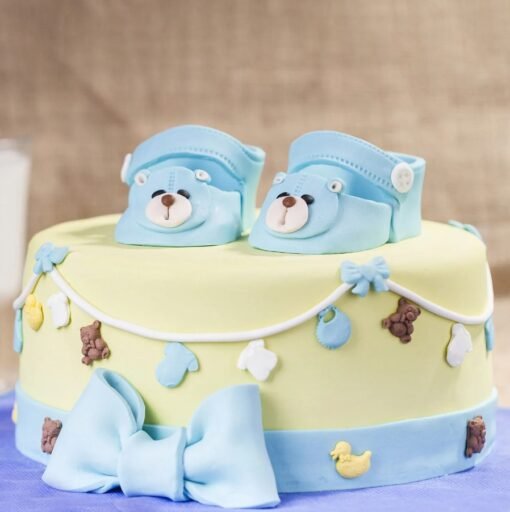 Baby-themed cake with cute tiny toes and pastel decorations, ideal for baby celebrations.