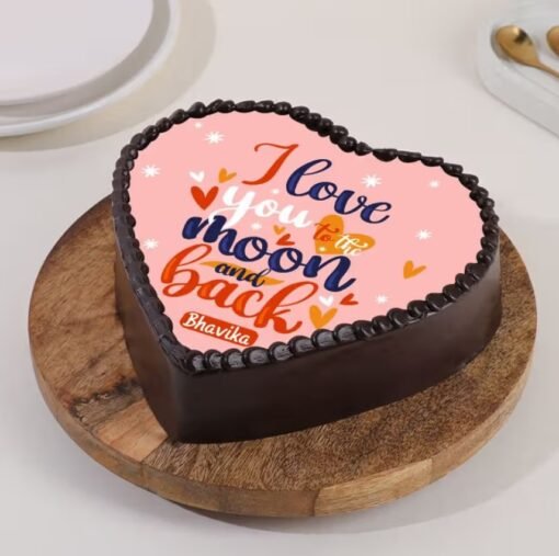 Romantic moon-themed cake with “I Love You to the Moon and Back” message in fondant or icing.