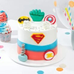 Colorful Superheroes themed birthday cake with comic book characters and vibrant decorations.
