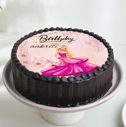 Princess Barbie Treat cake featuring a doll topper in a pink gown with elegant frosting and decorative details.