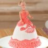 Doll cake featuring a vibrant orange buttercream gown with ruffled layers and pearl accents.