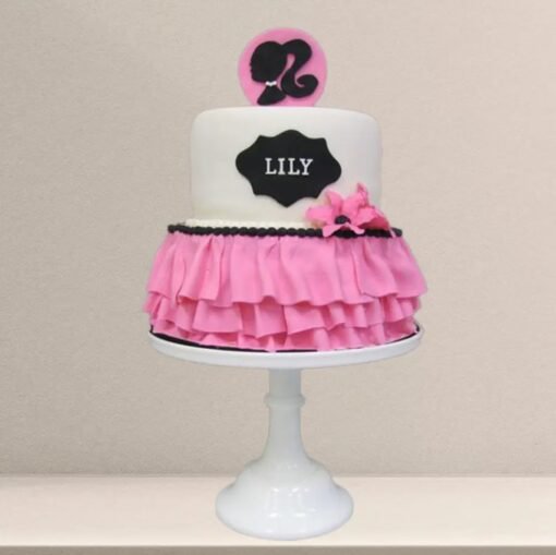 Barbie-themed cake shaped like a pink little dress with fondant detailing and stylish design.