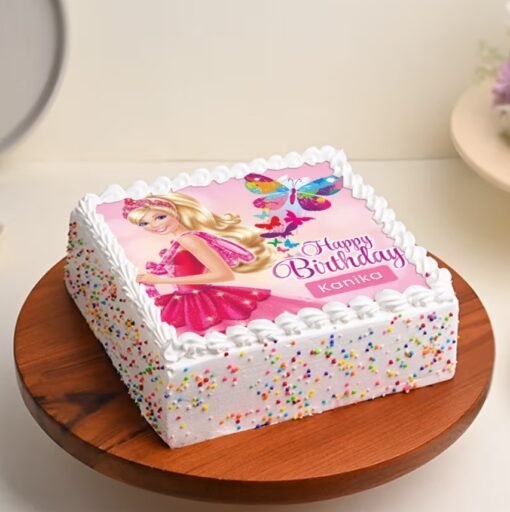 Runway Barbie Cake with a doll in a glam fondant gown, standing on a designer-inspired runway-themed cake.