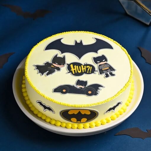 Batman-themed fondant cake with Gotham skyline, Bat-Signal, and superhero decorations in black and yellow for a bold birthday celebration.