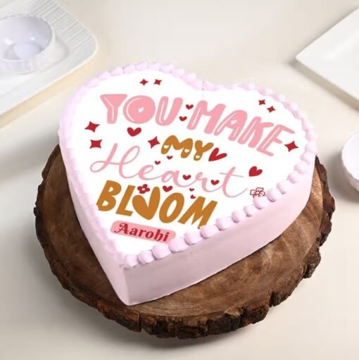 Multi-layered romantic cake with heart-shaped decor, perfect for anniversaries or Valentine's Day.