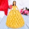 Belle doll cake wearing a golden buttercream ball gown adorned with red fondant roses and shimmering accents.