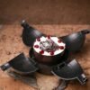 Foresty Bomb Cake featuring a chocolate shell with rustic forest-themed decor and hidden treats inside.
