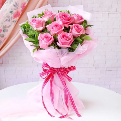 A graceful bouquet of soft pink roses beautifully arranged, symbolizing admiration, grace, and tender affection.