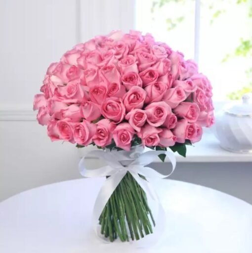 Elegant bouquet of bright pink roses wrapped beautifully, symbolizing affection, admiration, and sweet romantic love.