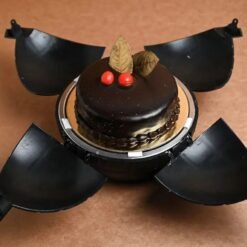 Chocolate bomb cake with rich ganache and decadent chocolate surprise filling.