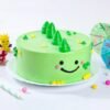 Tropical mermaid-themed cake decorated with sea shells, palm leaves, ocean waves, and colorful mermaid tails.