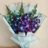 A breathtaking Azure Orchids Bouquet featuring vibrant blue orchids, perfect for adding a touch of elegance and charm to any celebration.