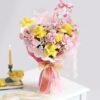 A vibrant Women's Day bouquet featuring fresh roses, lilies, and orchids, radiating beauty and appreciation.