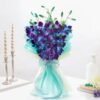 A breathtaking arrangement of magical orchids, radiating bliss and sophistication, ideal for expressing love, gratitude, and joy.